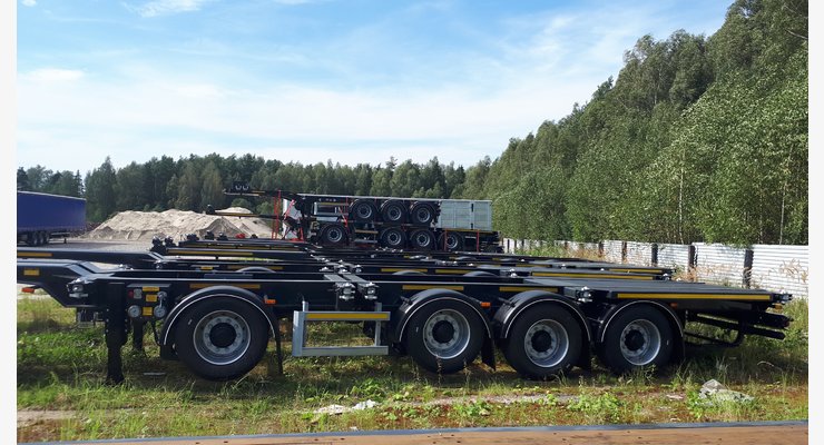 Полуприцеп-контейнеровоз Тонар K4-U, модель 99891 — боковой вид четырехосного шасси